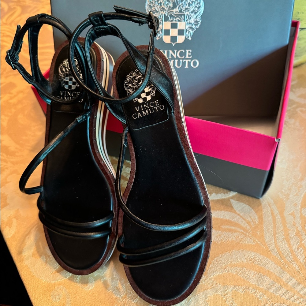 Stylish black designer sandals with wedge heel from Vince Camuto in size 7.